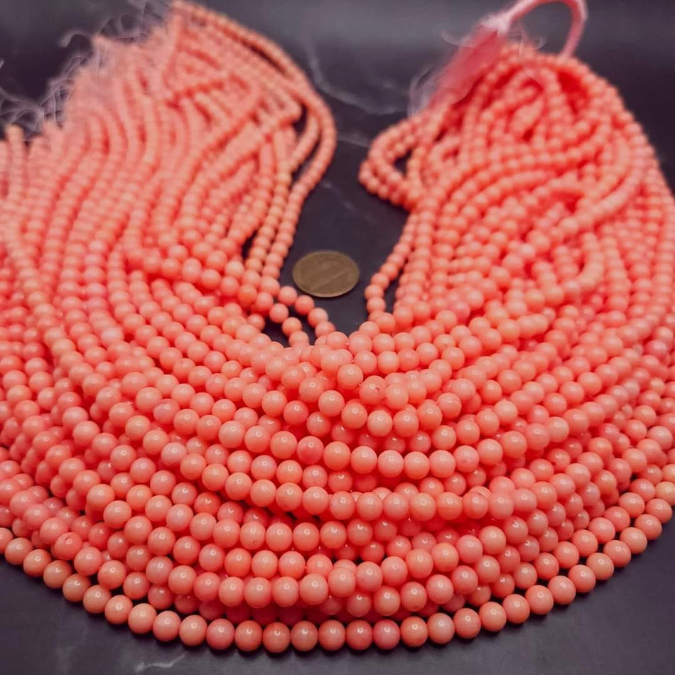 Peach Coral
5mm round, 16" strand