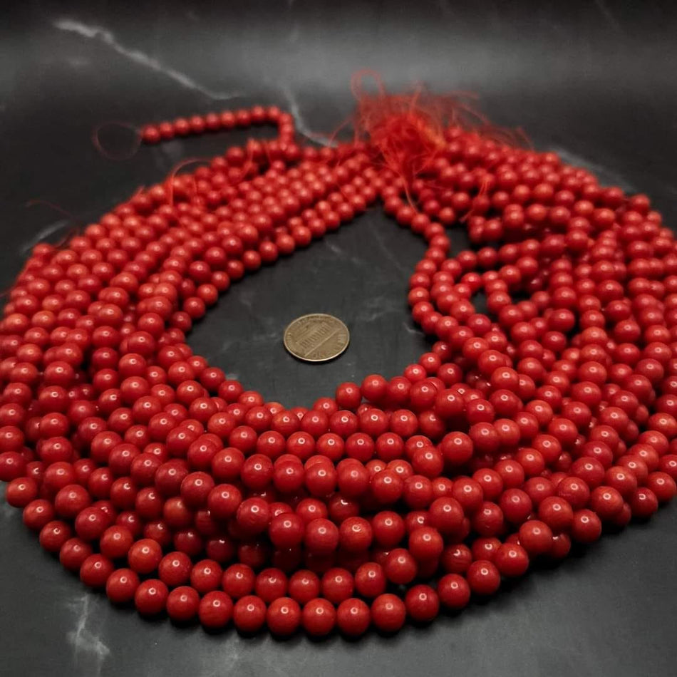 Red/orange Bamboo Coral
7mm round, 16" strand